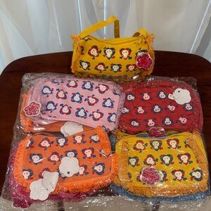 New One Dozen Charming kids' bags with playful hearted skulls.